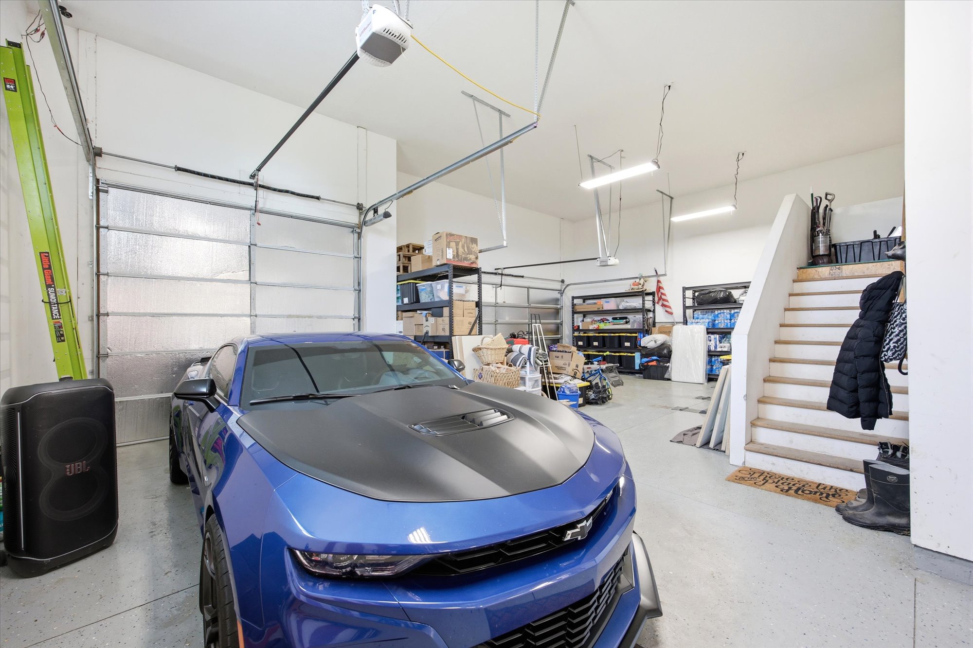 Garage featuring a garage door opener