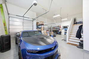 Garage featuring a garage door opener