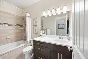 Full bath with vanity and tiled shower / bath combo