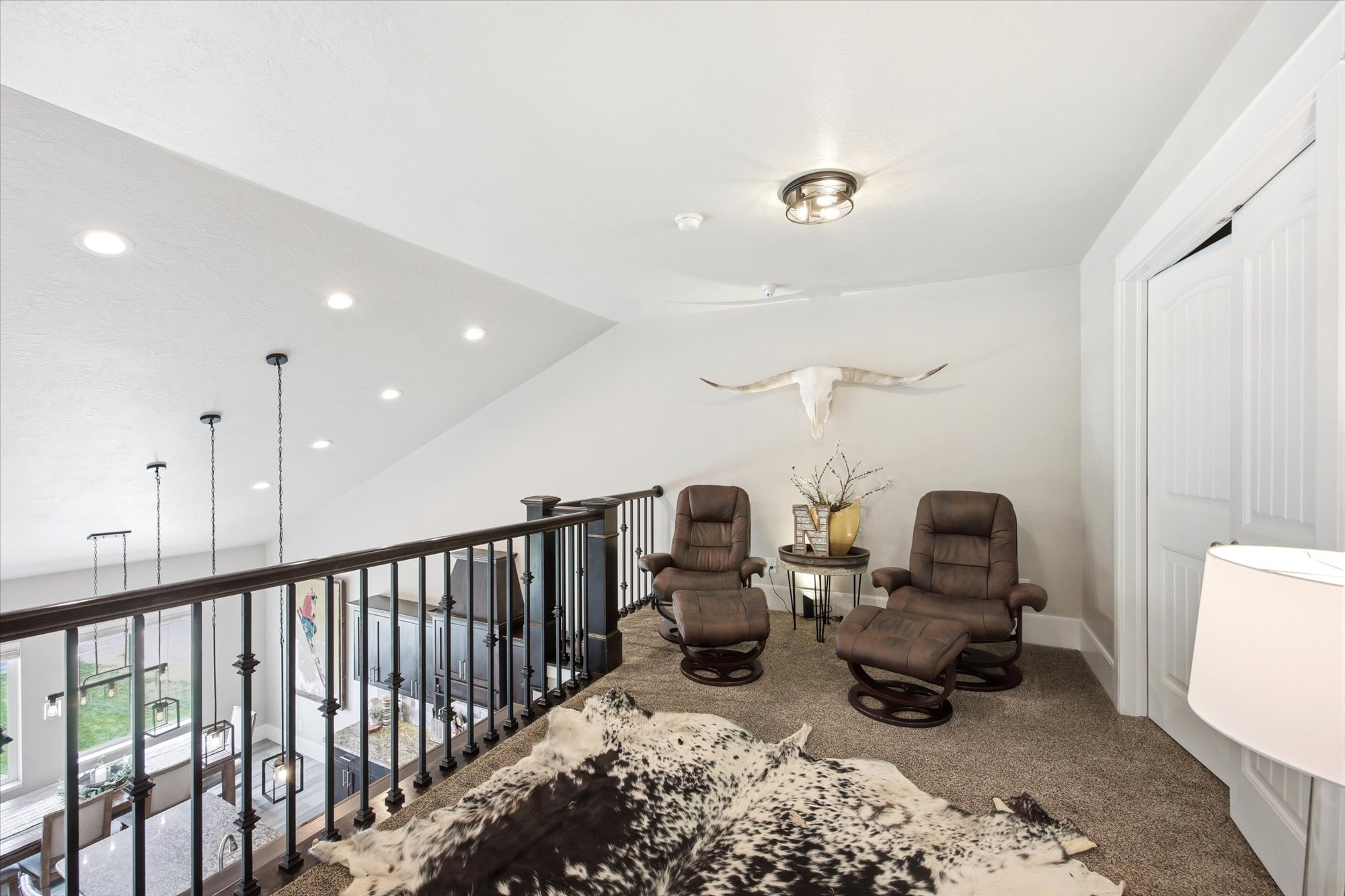 Living area with vaulted ceiling, carpet flooring, and recessed lighting