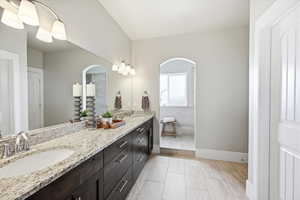 Full bathroom with double vanity and walk in shower