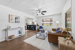 Living room featuring wood finished floors and a ceiling fan