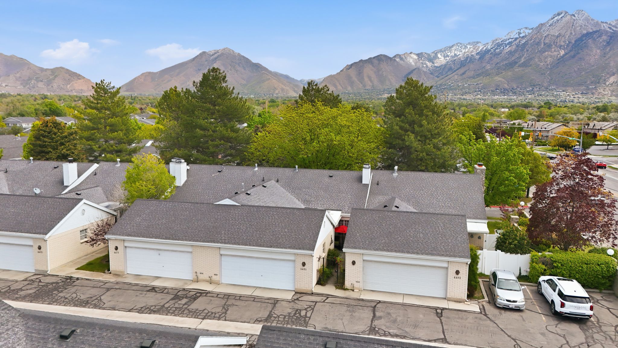 Aerial perspective of suburban area with a mountainous background
