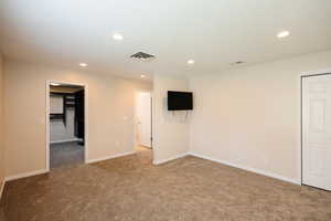 Unfurnished room featuring carpet and recessed lighting