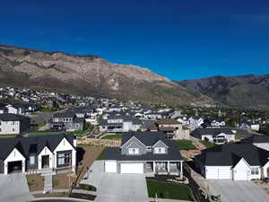 Residential neighborhood with varied architectural styles and mountain scenery