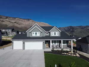 Modern gray siding exterior with white trim accents and a dark shingle roof