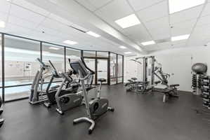 Exercise room featuring a drop ceiling