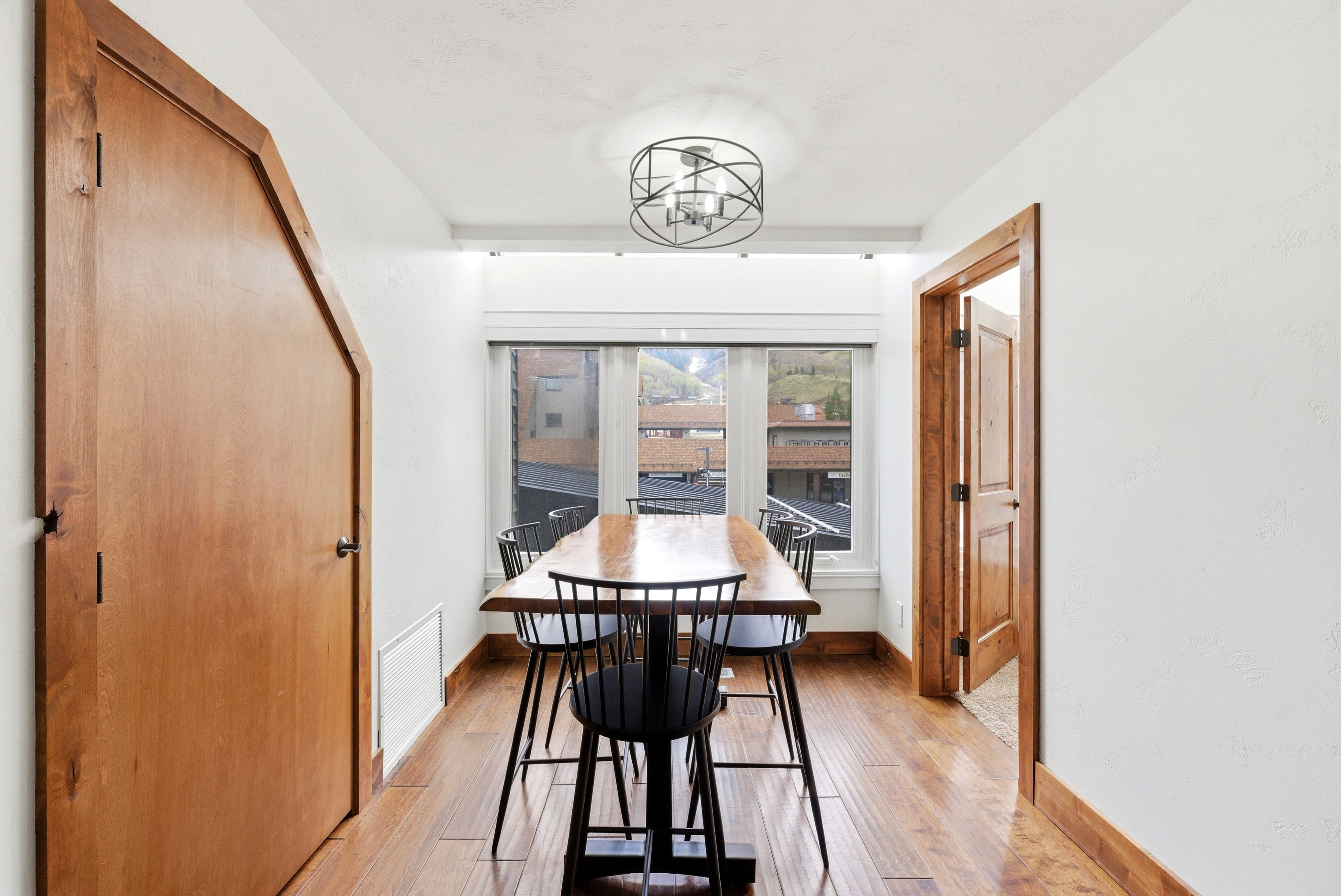 Dining space with light wood-type flooring and baseboards