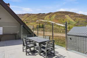 View of patio / terrace with outdoor dining area and a mountain view