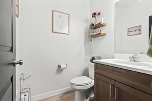 Bathroom with vanity and light wood-type flooring