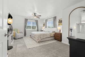 Bedroom featuring light colored carpet and ceiling fan