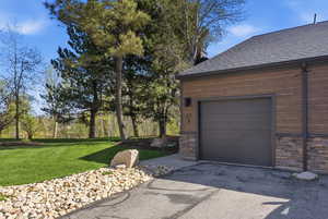 Garage with asphalt driveway