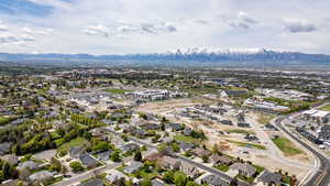 Aerial view of residential area featuring a mountain backdrop