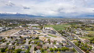 Aerial perspective of suburban area with a mountainous background