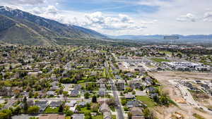 Aerial view of residential area featuring a mountainous background