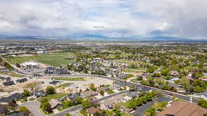 Aerial perspective of suburban area with a mountain backdrop