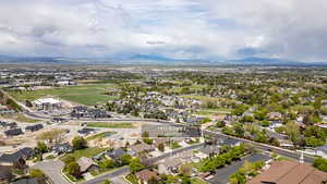 Aerial perspective of suburban area with a mountainous background