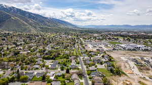 Aerial perspective of suburban area featuring a mountain backdrop