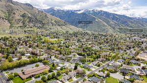 Aerial view of residential area featuring mountains