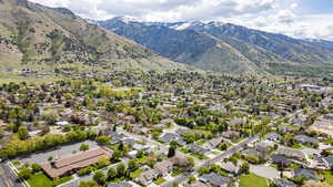 Aerial perspective of suburban area with a mountainous background