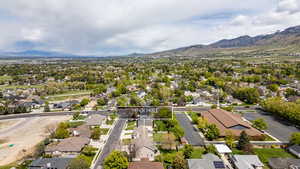 Aerial view of residential area featuring mountains