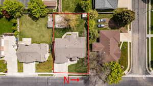 Aerial perspective of suburban area with property boundaries highlighted
