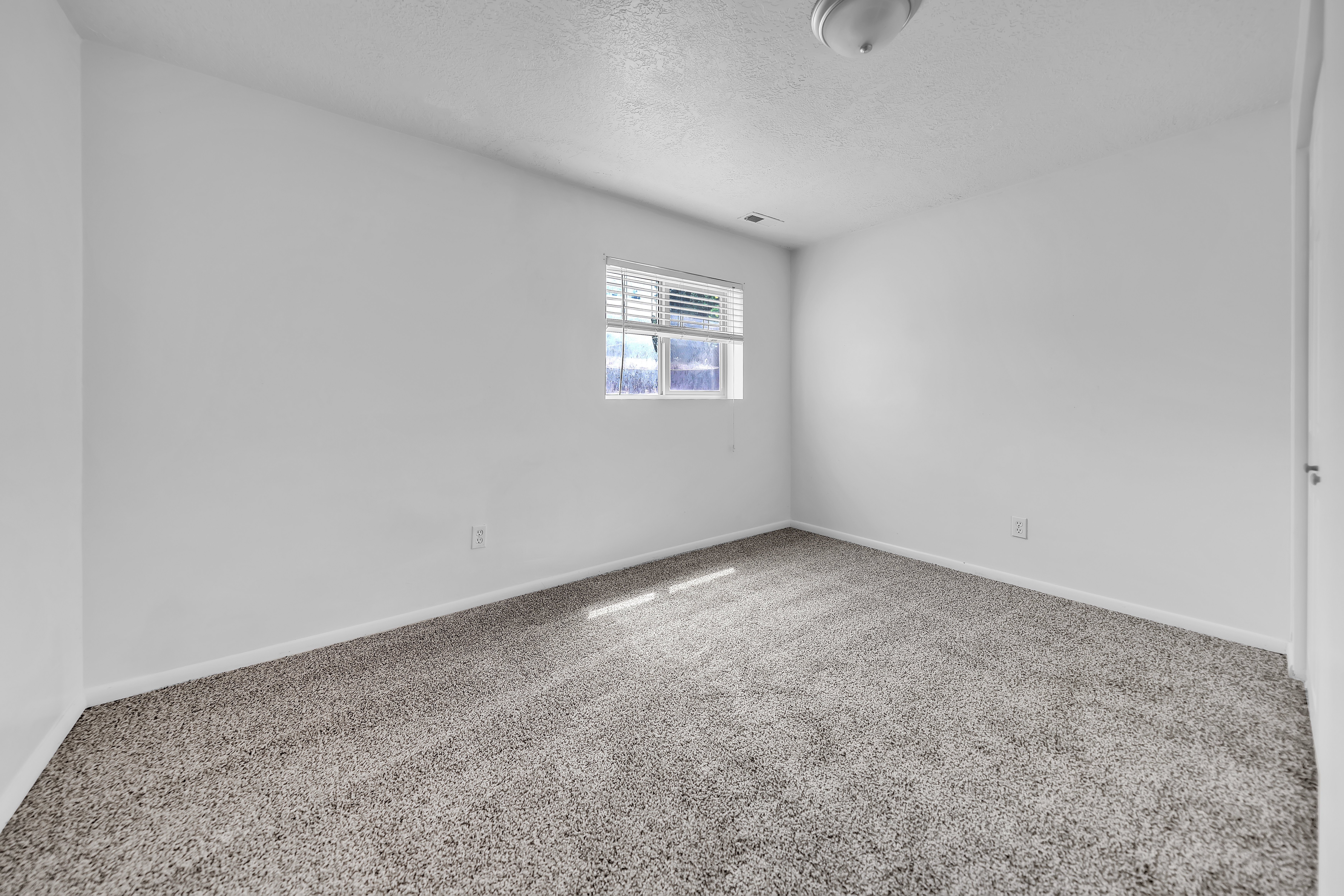 Neutral tone wall paint with baseboard trim