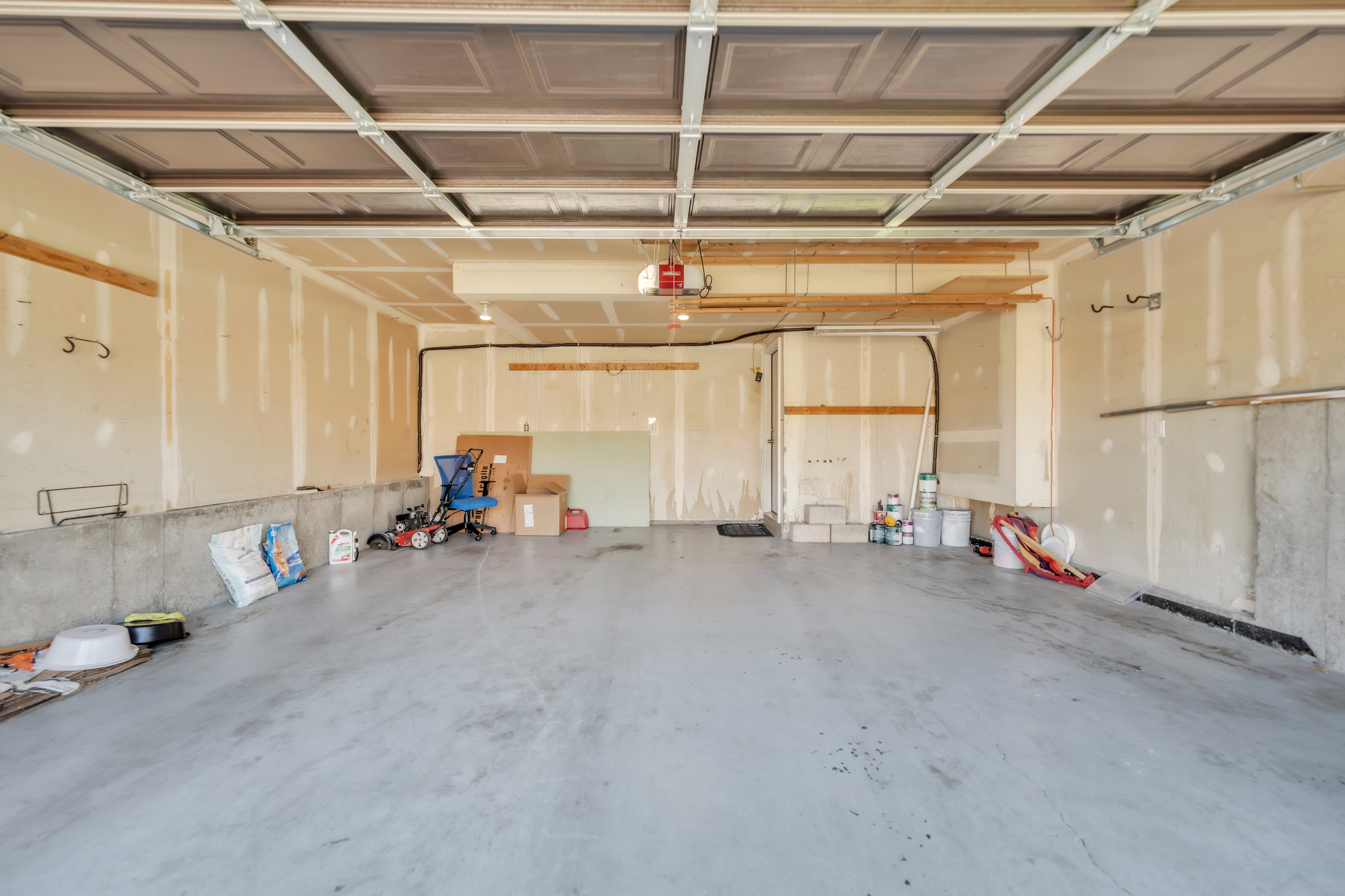 Garage featuring a garage door opener