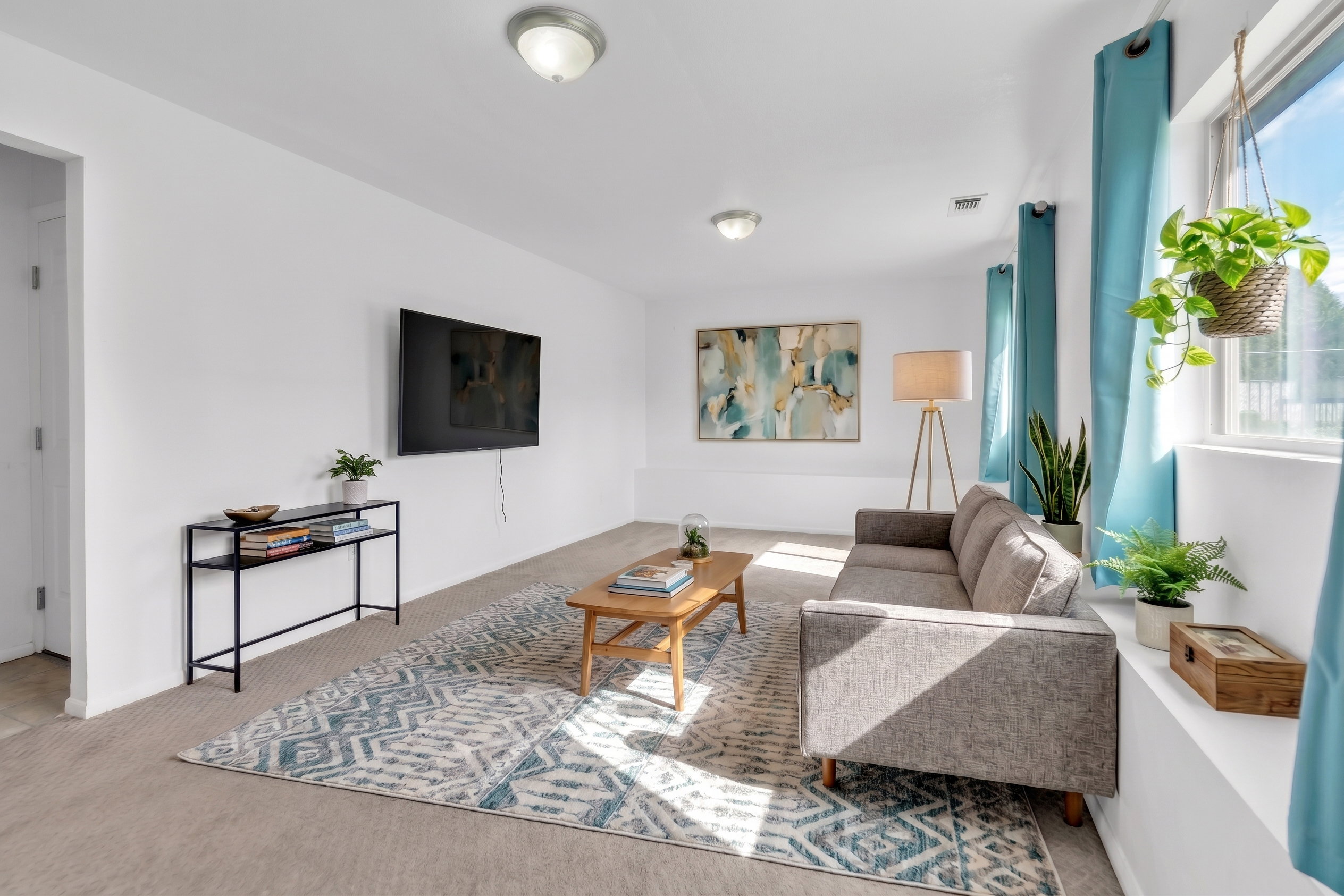 Living room featuring carpet floors and healthy amount of natural light