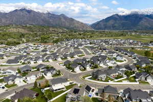 Aerial perspective of suburban area featuring a mountainous background