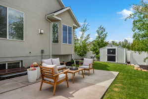 View of patio / terrace with an outdoor lounge area and a storage unit