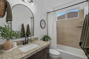 Full bath with vanity and shower / bathtub combination with curtain