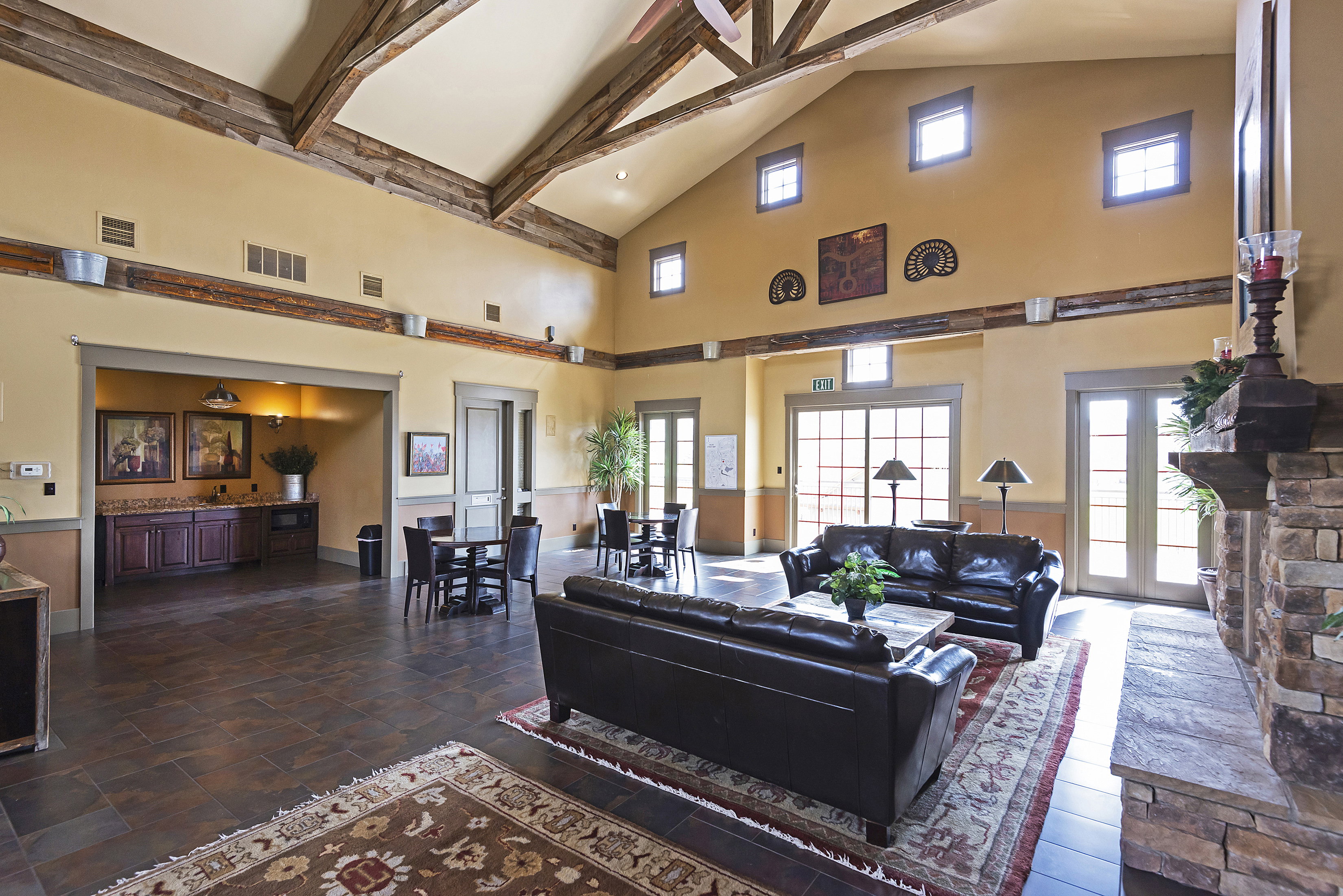 Living room with lofted ceiling and a wainscoted wall