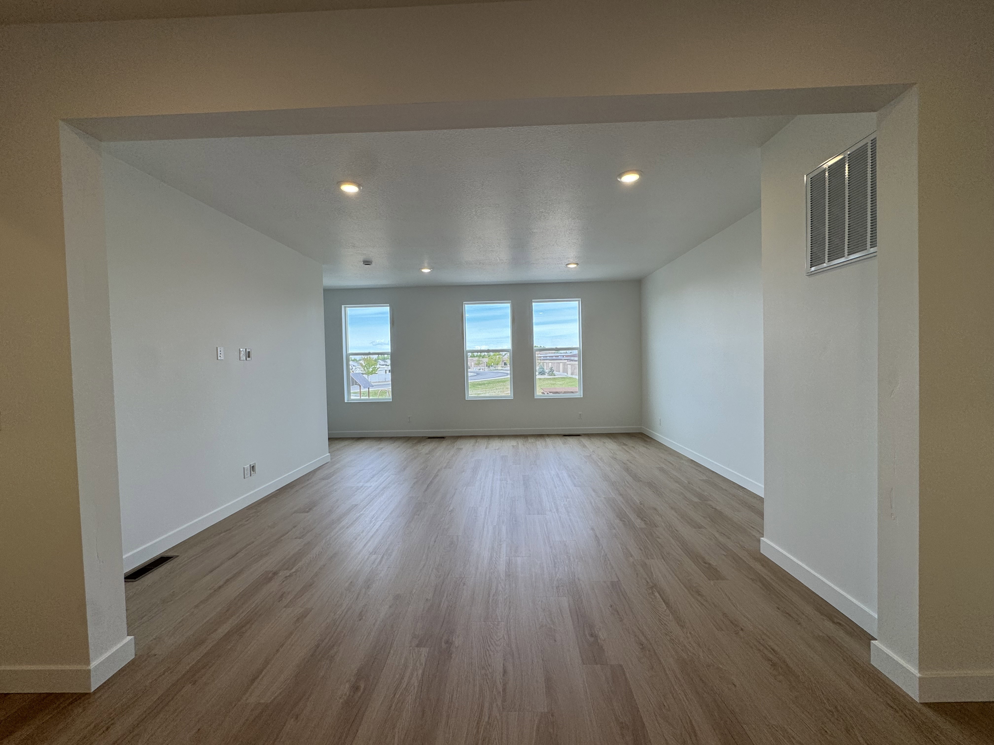 Empty room with recessed lighting and light wood-style flooring