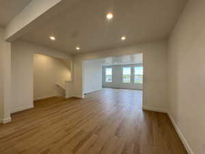 Unfurnished living room with recessed lighting and light wood finished floors