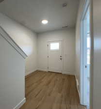 Entryway featuring light wood-style floors and baseboards