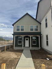View of front of property featuring a porch and a mountain view