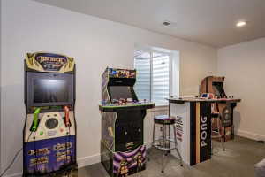 Game room with carpet and baseboards