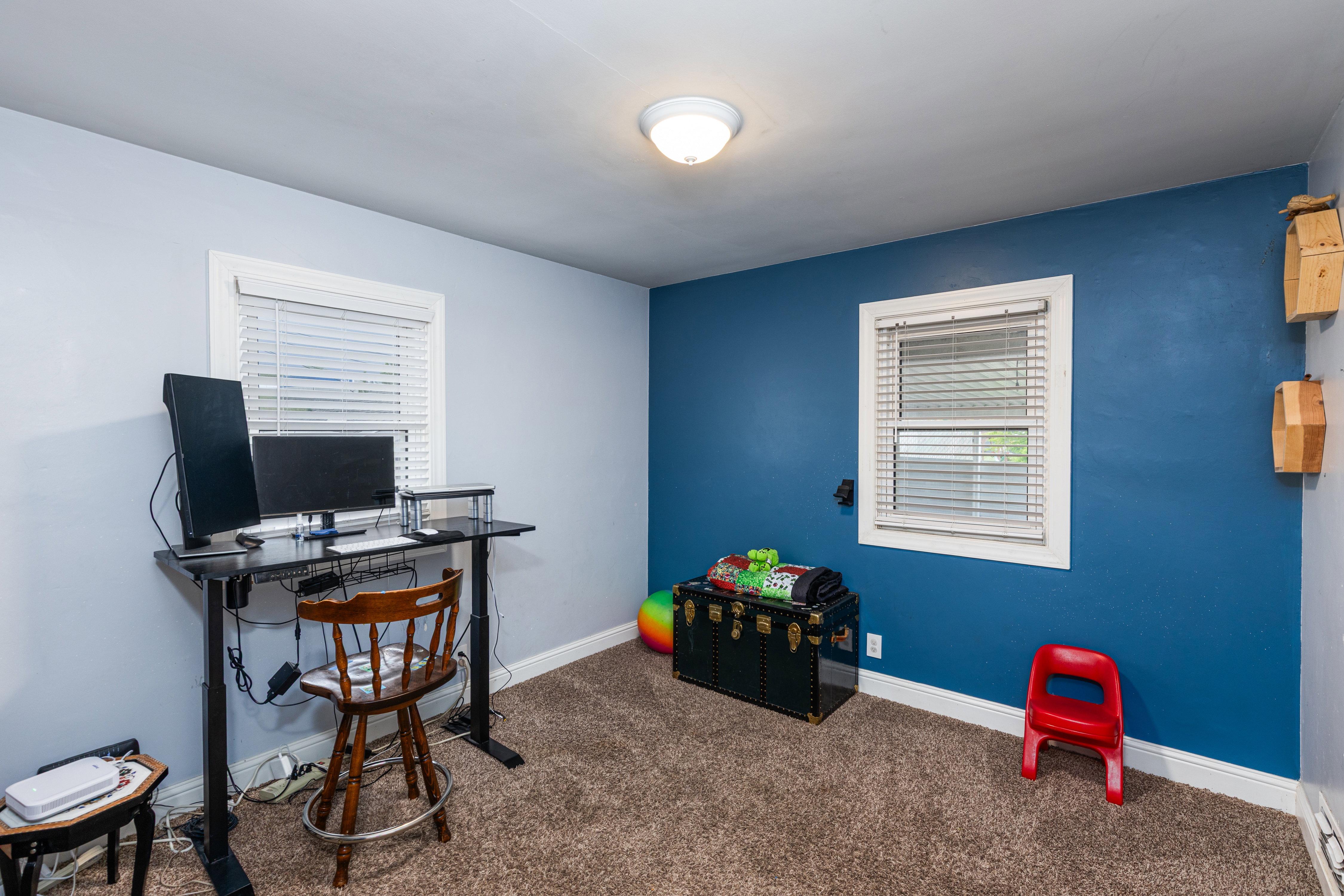 Carpeted home office with baseboards
