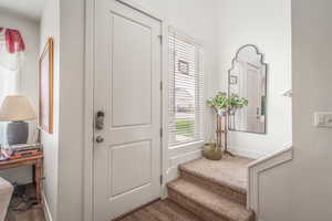 Entryway featuring wood finished floors and baseboards