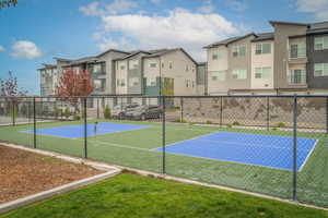 View of sport court with a tennis court