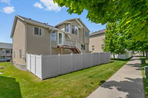Rear view of property with stucco siding