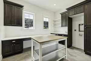 This laundry room also has plenty of room to double as the pantry.
