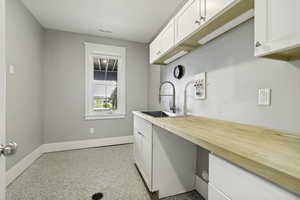 This is a hobby room, but could easily be another bathroom or another laundry room.