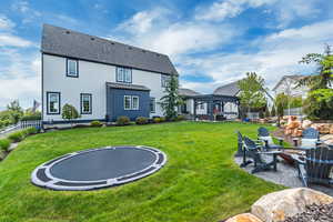 Large private yard with inset trampoline.