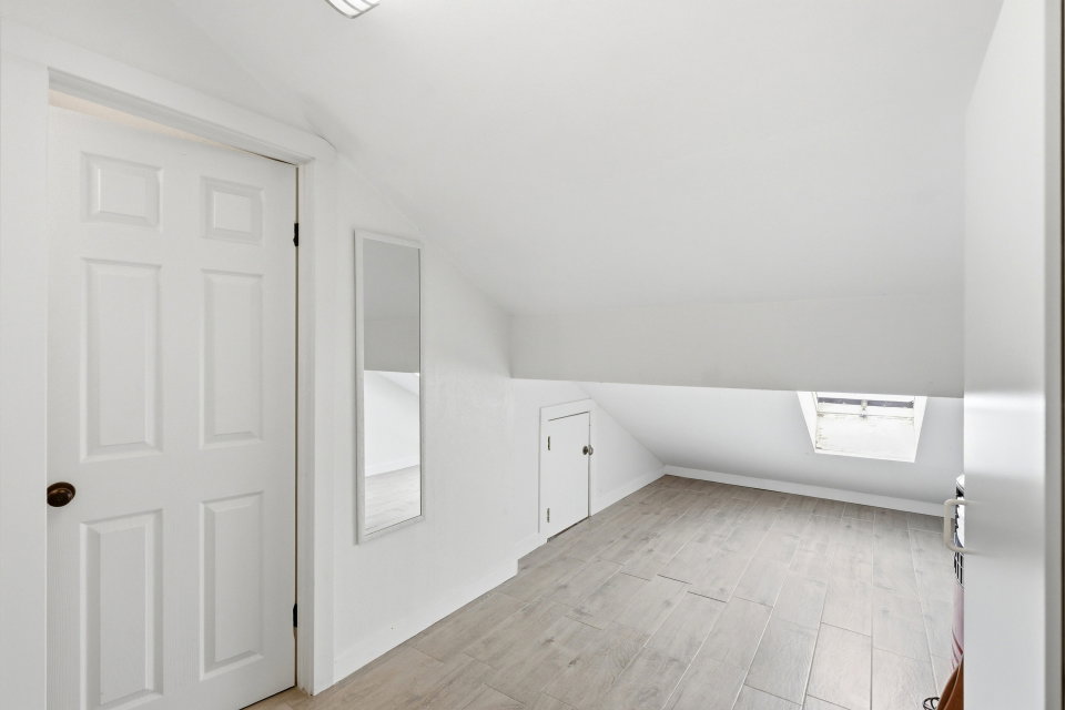 Bonus room featuring vaulted ceiling and light wood-type flooring