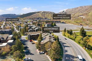 Aerial view of property and surrounding area with a mountainous background