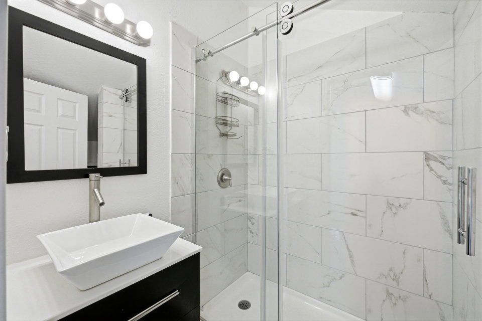 Bathroom with a stall shower and vanity