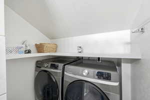 Laundry area with washing machine and clothes dryer