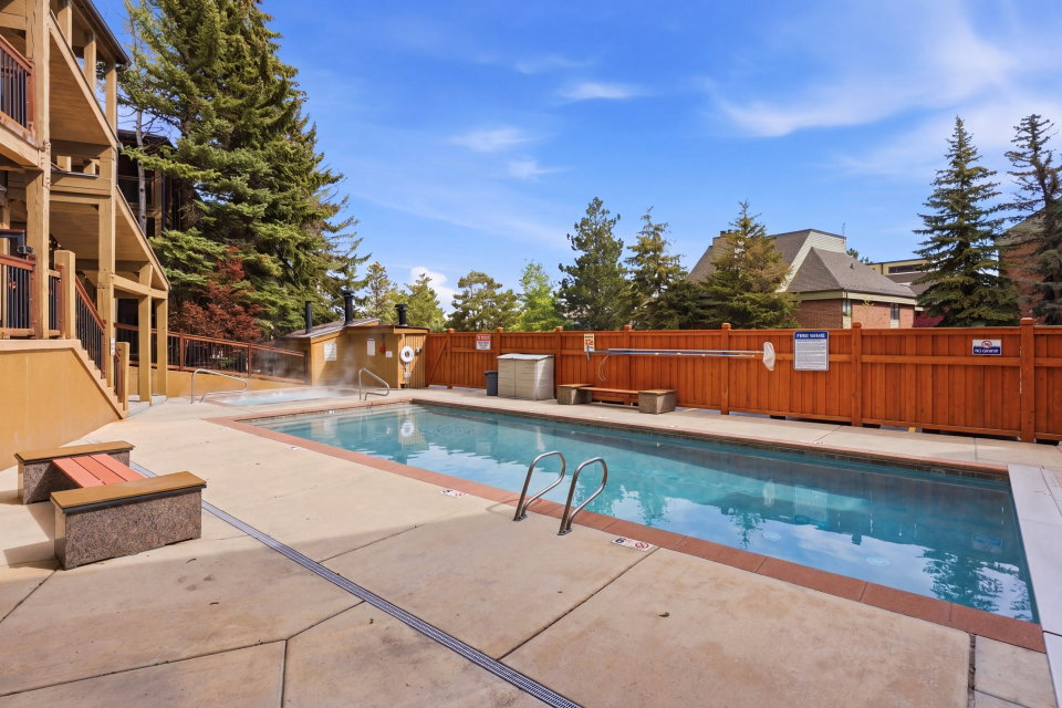 Community pool with a patio area